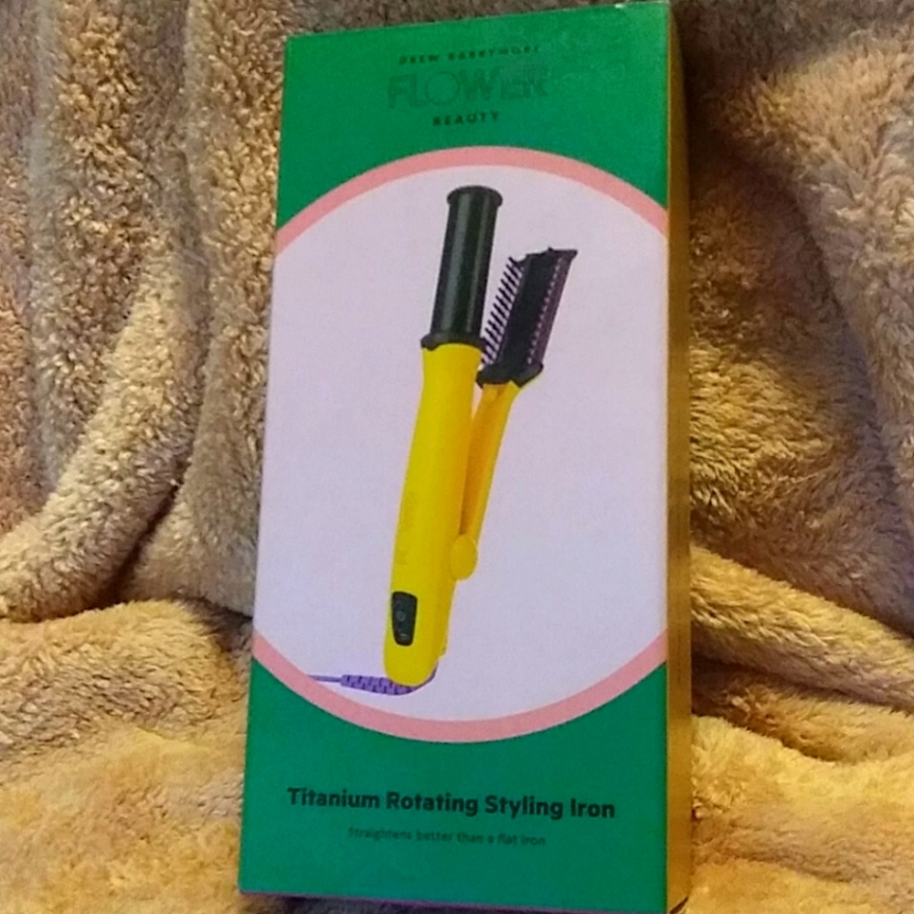 Rotating styling iron